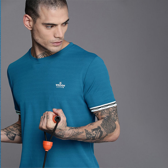 https://www.goldensgrove.in/products/men-teal-blue-brand-logo-printed-casual-t-shirt